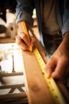 Man Measuring Board